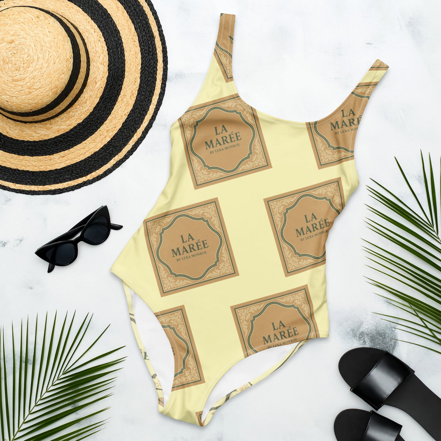 Elegant, sleek and stylish swimwear one-piece swimsuit with a low back by La Marée, designed for a flattering silhouette and coastal style.