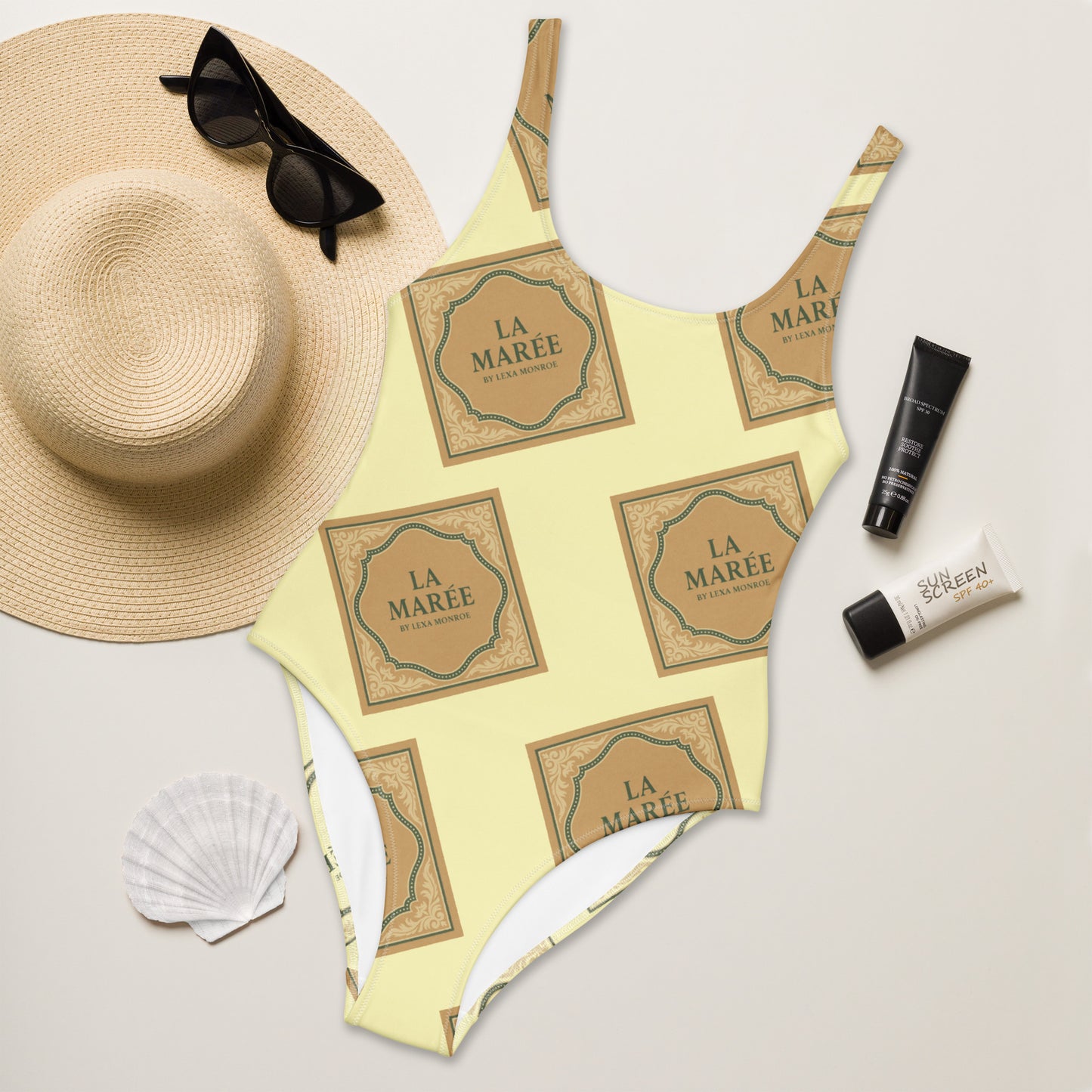 Elegant, sleek and stylish swimwear one-piece swimsuit with a low back by La Marée, designed for a flattering silhouette and coastal style.